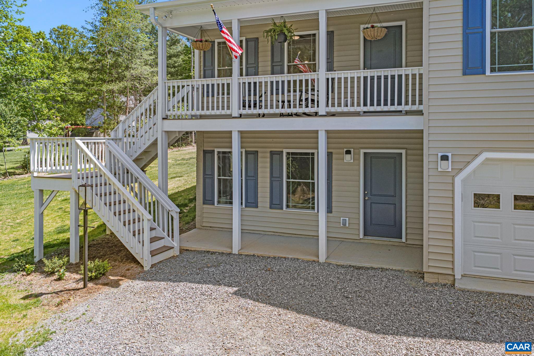 230 Fox Hollow Road Ruckersville, VA 22968 - Photo 7 of 42 a front view of a house with a yard