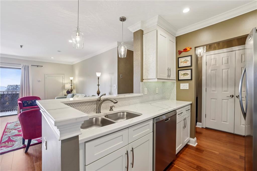 a kitchen with a sink stove and refrigerator