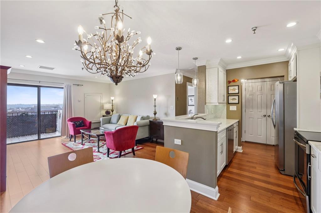 300 Johnson Ferry Road, Unit B804 Sandy Springs, GA 30328 - Photo 12 of 37 a large kitchen with a table and chairs