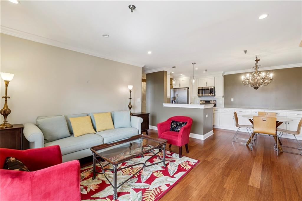 300 Johnson Ferry Road, Unit B804 Sandy Springs, GA 30328 - Photo 14 of 37 a living room with furniture and kitchen view