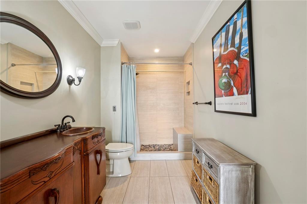 300 Johnson Ferry Road, Unit B804 Sandy Springs, GA 30328 - Photo 19 of 37 a bathroom with a sink a toilet and a mirror