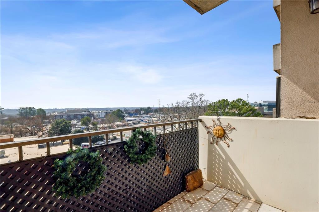 300 Johnson Ferry Road, Unit B804 Sandy Springs, GA 30328 - Photo 25 of 37 a view of city and mountain from a balcony