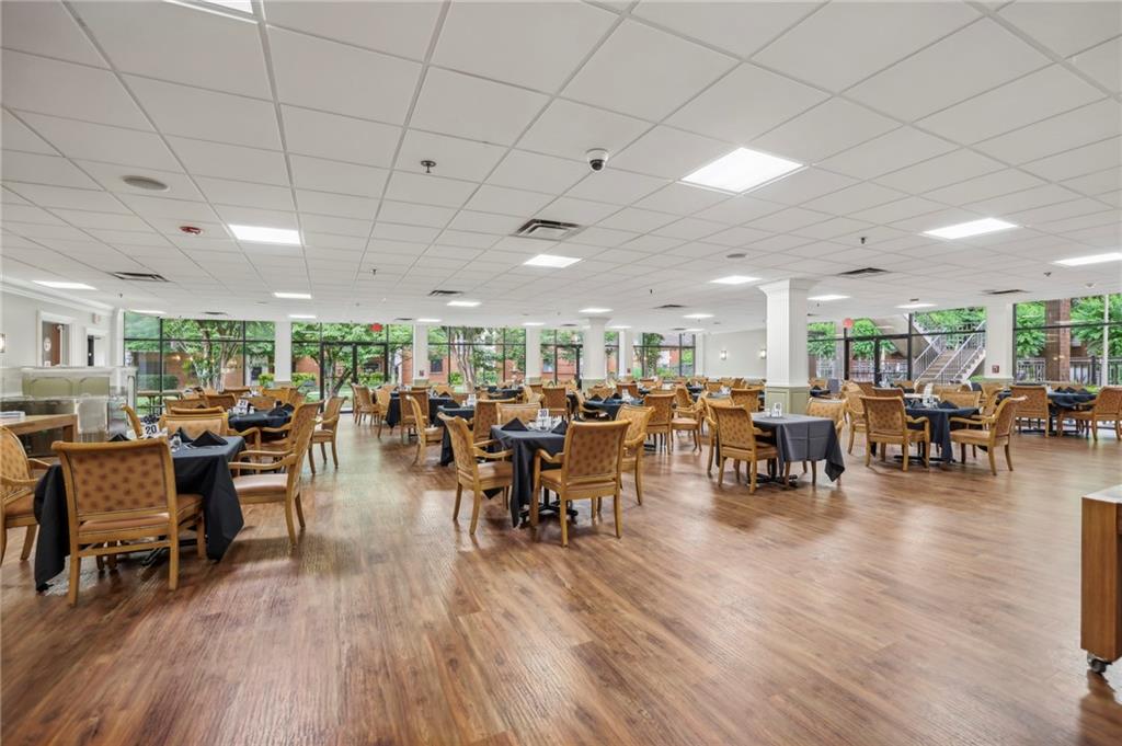 300 Johnson Ferry Road, Unit B804 Sandy Springs, GA 30328 - Photo 27 of 37 a room with lots of furniture and wooden floors
