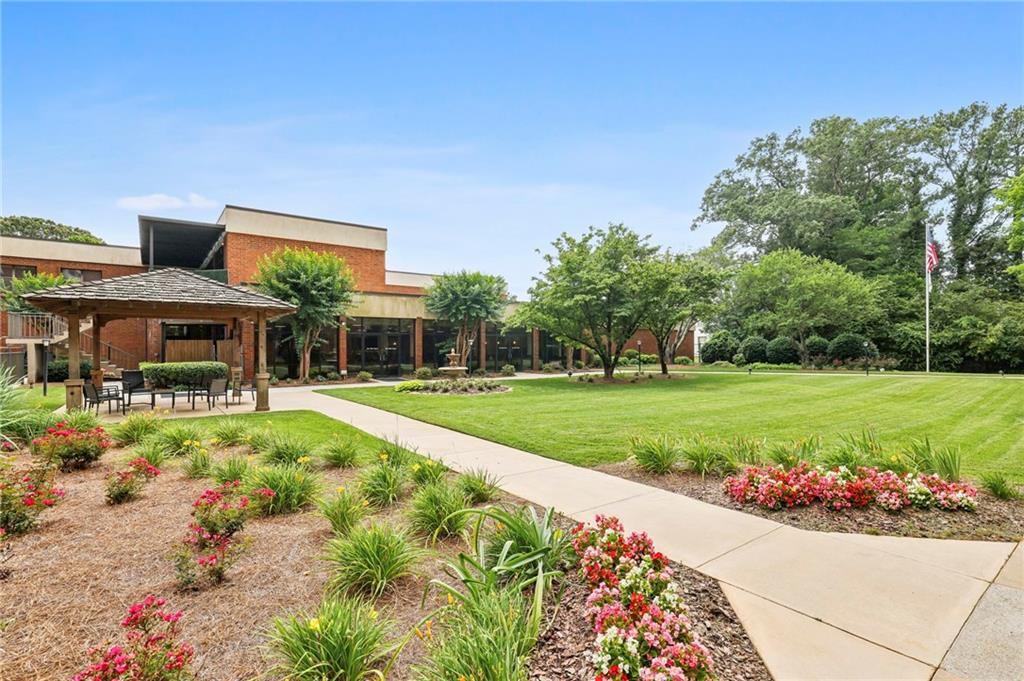 300 Johnson Ferry Road, Unit B804 Sandy Springs, GA 30328 - Photo 29 of 37 a front view of a house with a yard