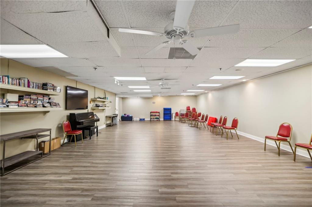 300 Johnson Ferry Road, Unit B804 Sandy Springs, GA 30328 - Photo 31 of 37 a view of an empty room with furniture and a flat screen tv