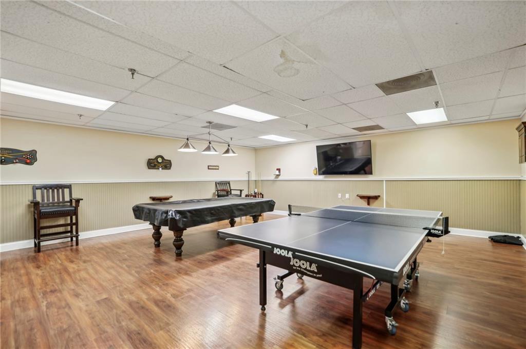 300 Johnson Ferry Road, Unit B804 Sandy Springs, GA 30328 - Photo 32 of 37 a workspace with furniture pool table and a flat screen tv