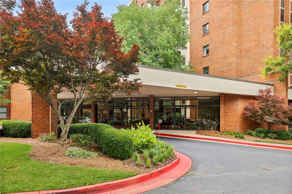 300 Johnson Ferry Road, Unit B804 Sandy Springs, GA 30328 - Photo 35 of 37 front view of a house with a yard