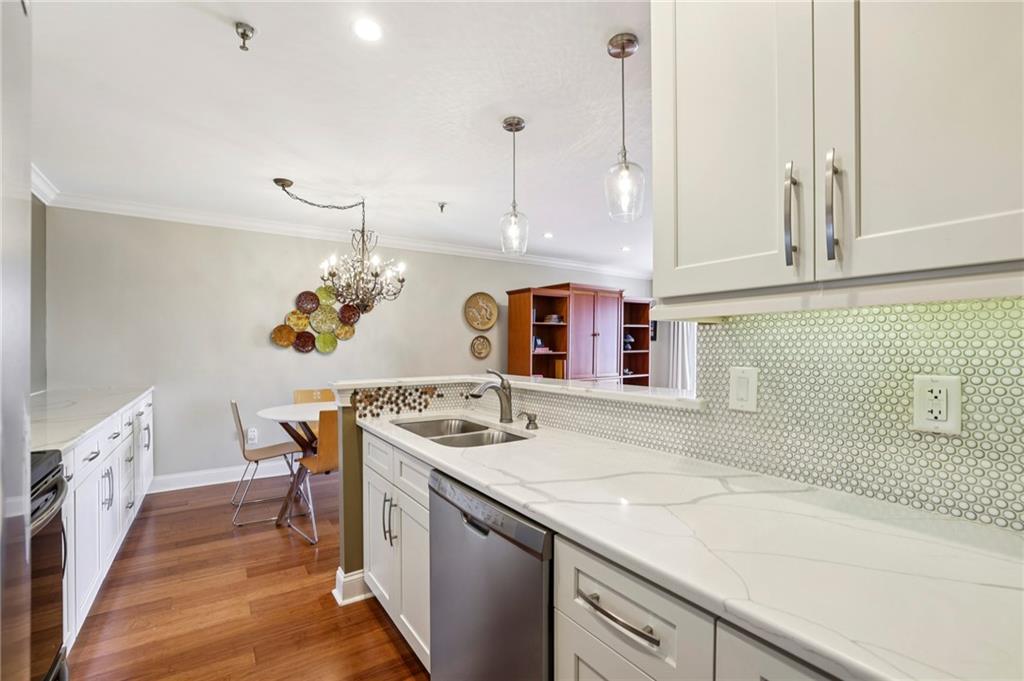 300 Johnson Ferry Road, Unit B804 Sandy Springs, GA 30328 - Photo 4 of 37 a kitchen with a stove a sink and a refrigerator