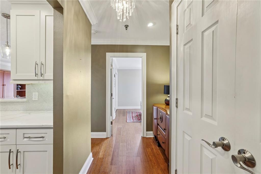 300 Johnson Ferry Road, Unit B804 Sandy Springs, GA 30328 - Photo 5 of 37 a hallway with wooden floor