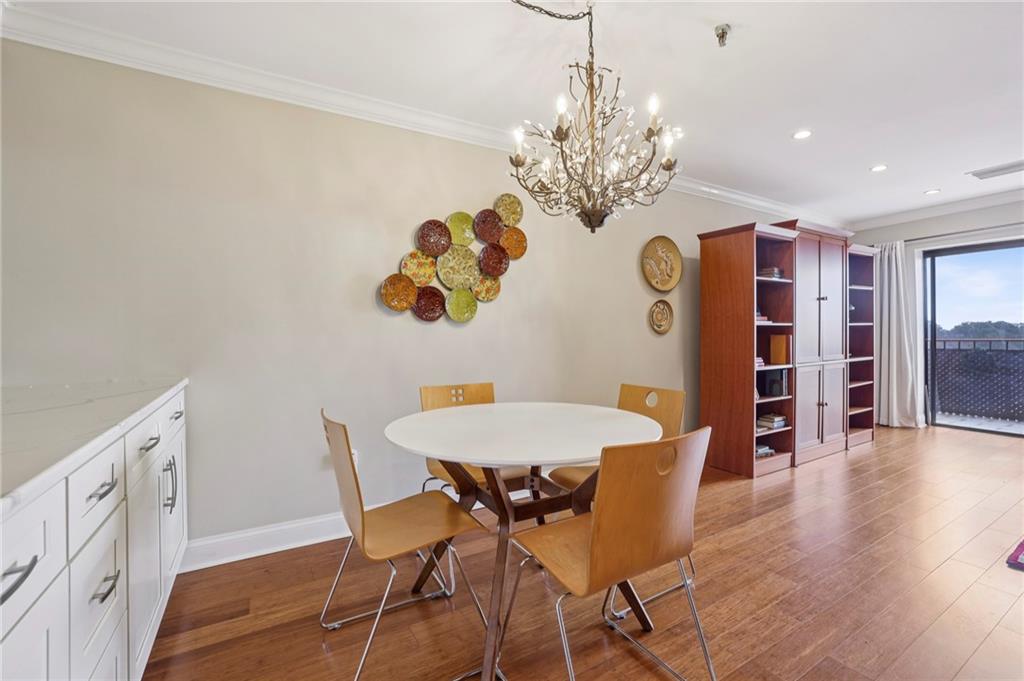 300 Johnson Ferry Road, Unit B804 Sandy Springs, GA 30328 - Photo 9 of 37 a view of a dining room with furniture and chandelier