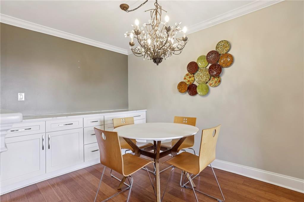300 Johnson Ferry Road, Unit B804 Sandy Springs, GA 30328 - Photo 10 of 37 a view of a dining room with furniture and chandelier