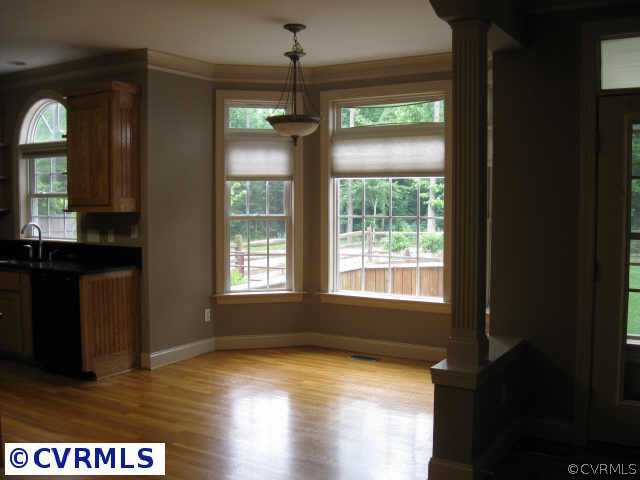 14319 River Road Chesterfield, VA 23838 - Photo 4 of 9 a view of an empty room with window and wooden floor