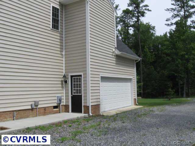 14319 River Road Chesterfield, VA 23838 - Photo 9 of 9 a view of a house with a yard and garage