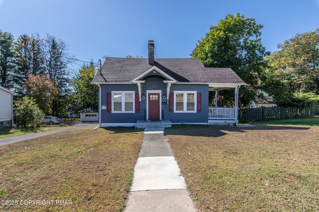 a front view of a house with yard