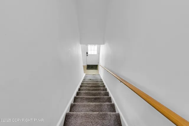 a view of a house with a yard and garage