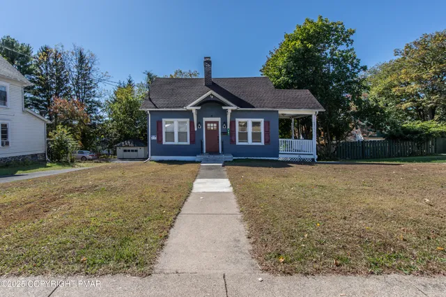 a house view with a garden space