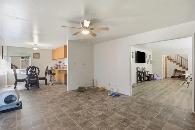 a kitchen with stainless steel appliances granite countertop sink stove and refrigerator