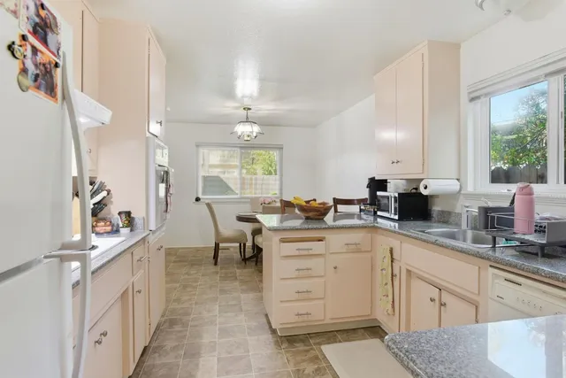 a bedroom with furniture and a flat screen tv