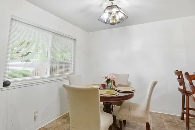 a bedroom with a bed and a flat tv screen on a dresser