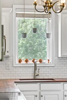 a bathroom with a white bath tub and a shower