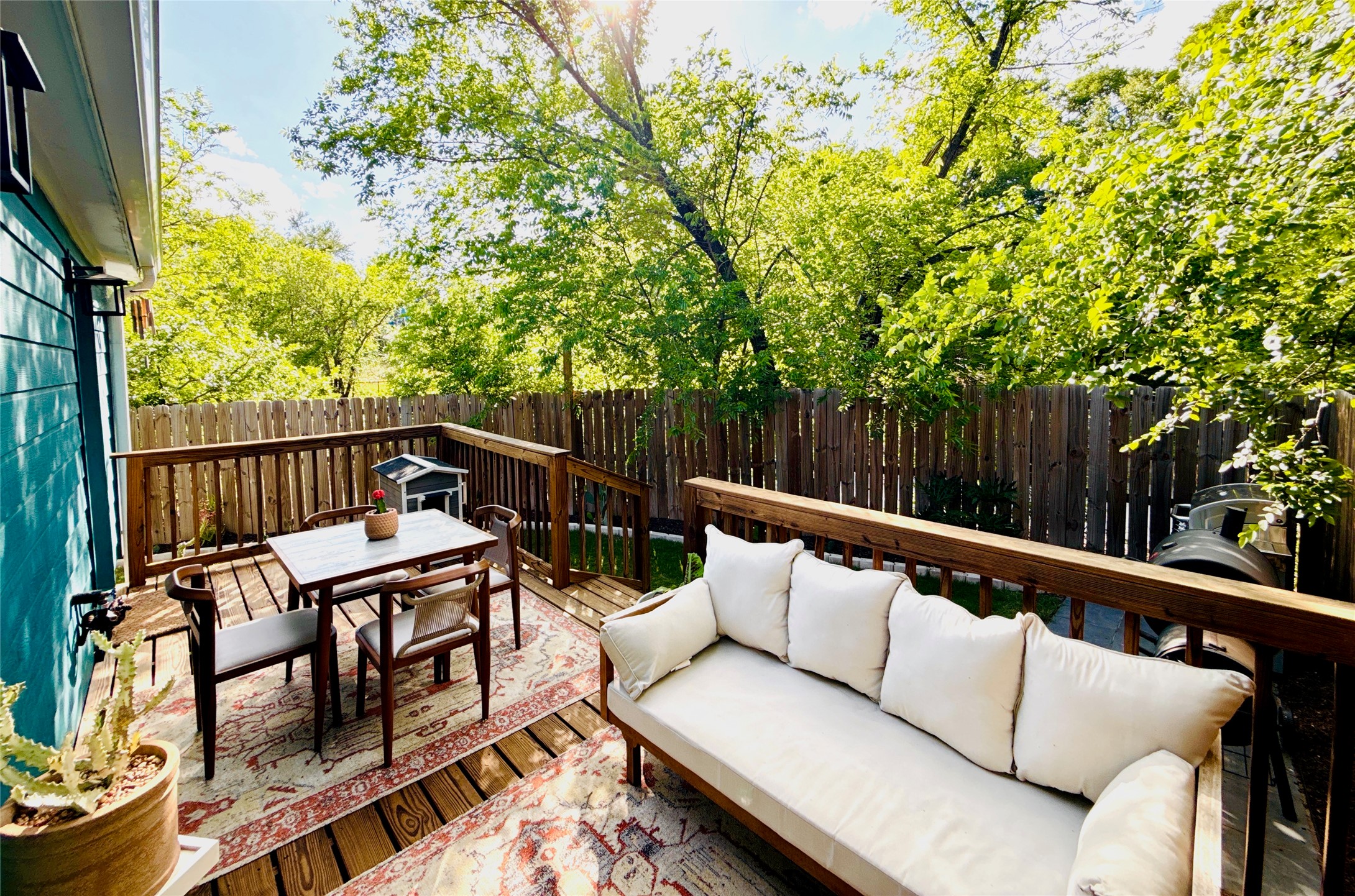 1616 Webberville Road, Unit A Austin, TX 78721 - Photo 29 of 35 The property features an outdoor deck with wood flooring and a privacy fence