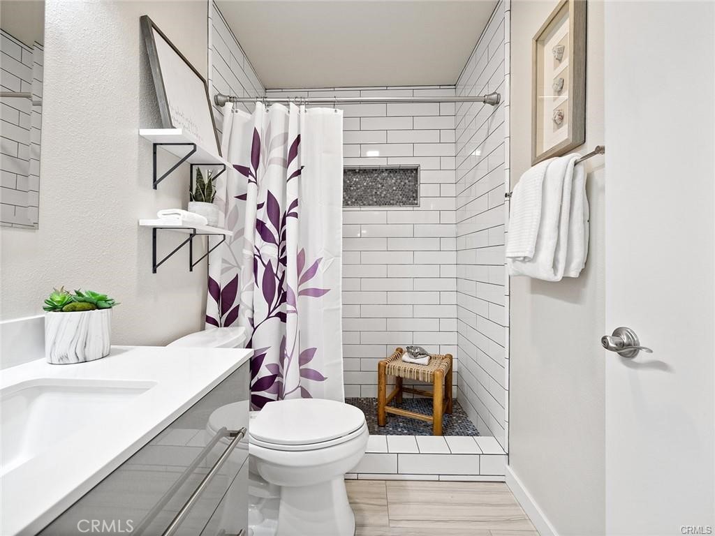 61 Orange Blossom Irvine, CA 92618 - Photo 15 of 40 a bathroom with a sink toilet and shower