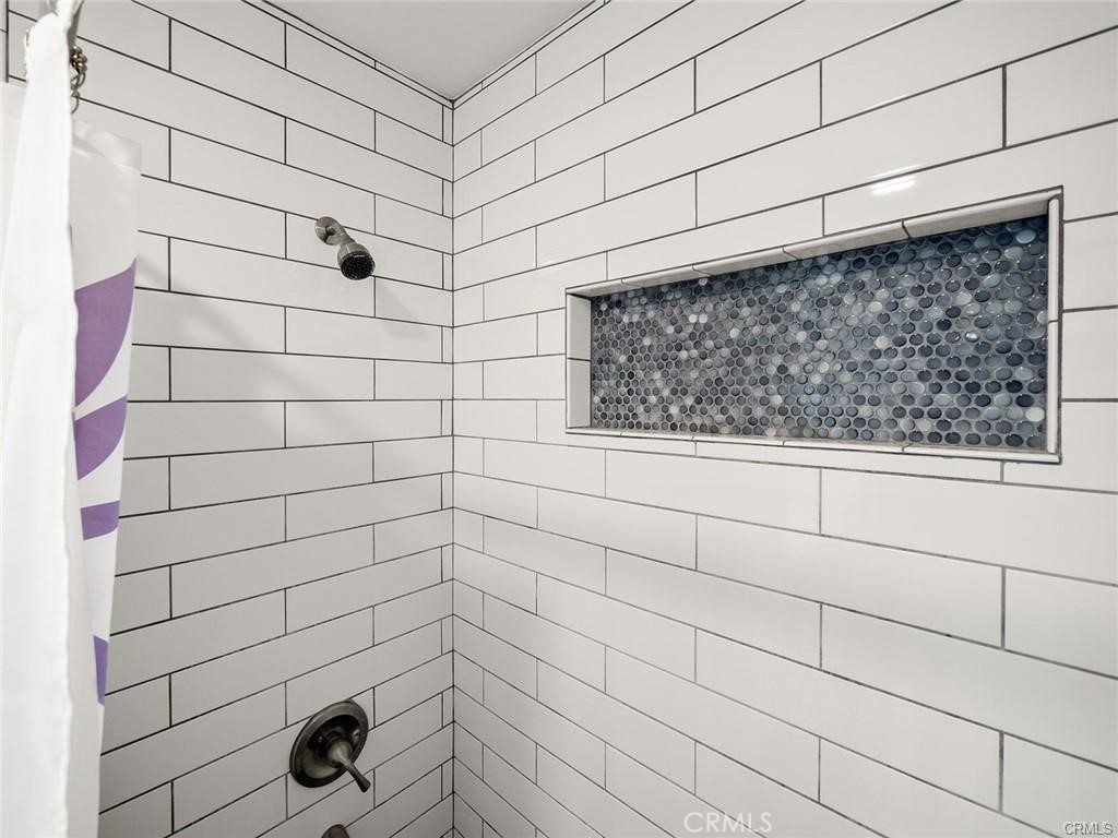 61 Orange Blossom Irvine, CA 92618 - Photo 17 of 40 a bathroom with a shower