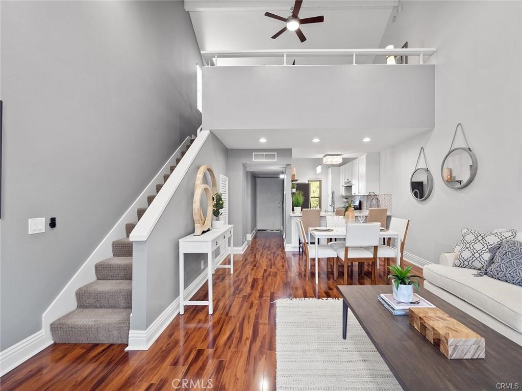 61 Orange Blossom Irvine, CA 92618 - Photo 18 of 40 a living room with furniture and wooden floor
