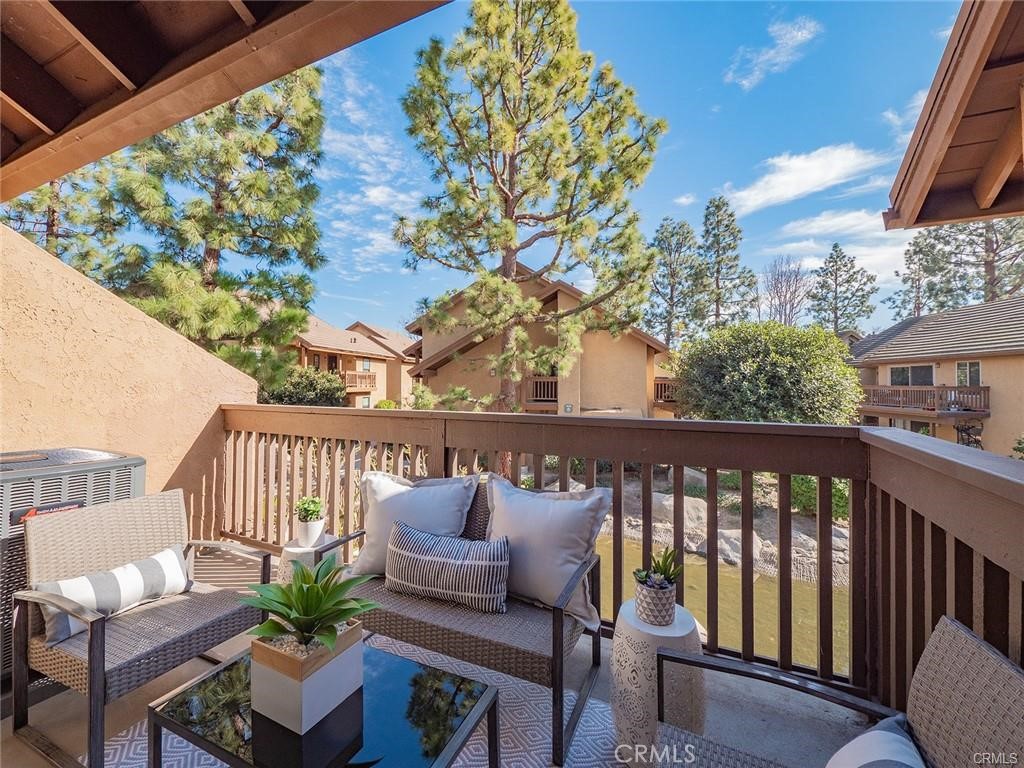 61 Orange Blossom Irvine, CA 92618 - Photo 22 of 40 a view of a chair in wooden deck