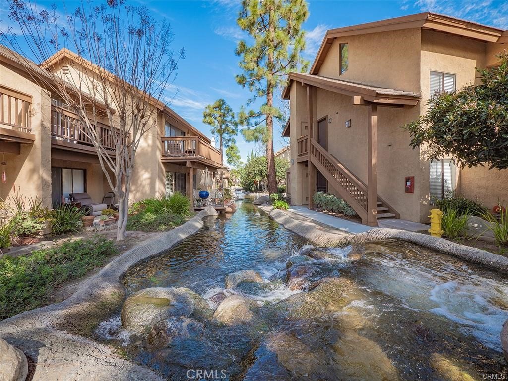 61 Orange Blossom Irvine, CA 92618 - Photo 27 of 40 a view of a house with a yard
