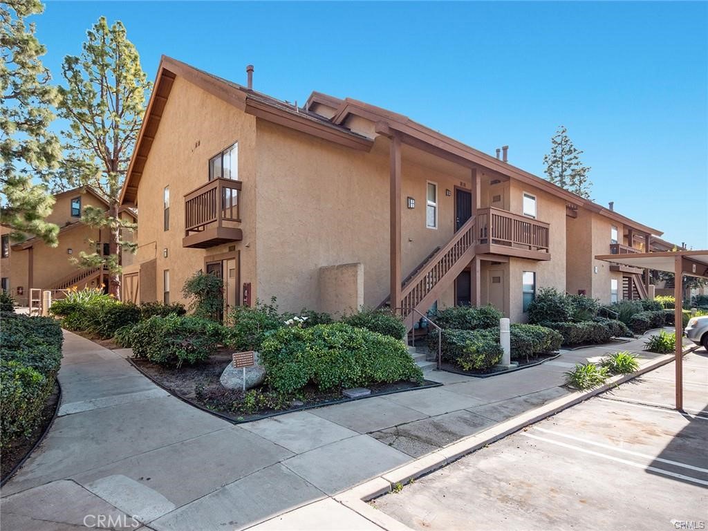 61 Orange Blossom Irvine, CA 92618 - Photo 29 of 40 a front view of a house with garden