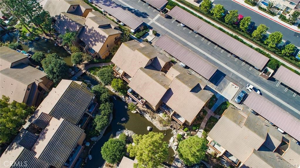 61 Orange Blossom Irvine, CA 92618 - Photo 33 of 40 an aerial view of a house with a yard and a large tree