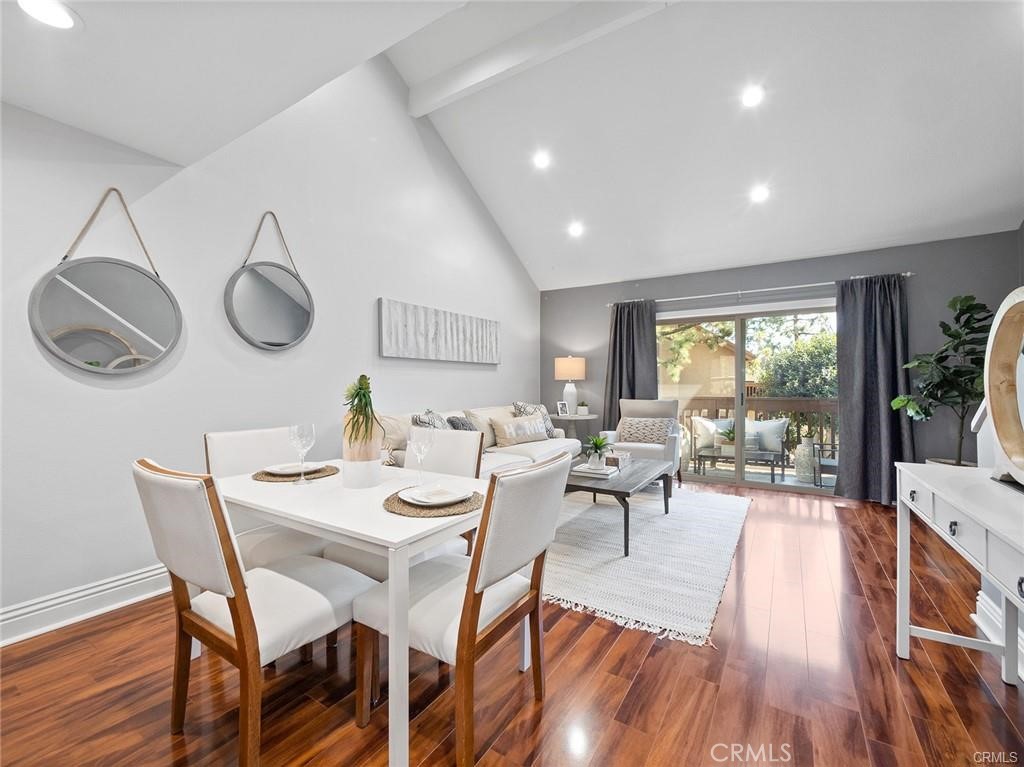61 Orange Blossom Irvine, CA 92618 - Photo 6 of 40 a view of a dining room with furniture window and wooden floor