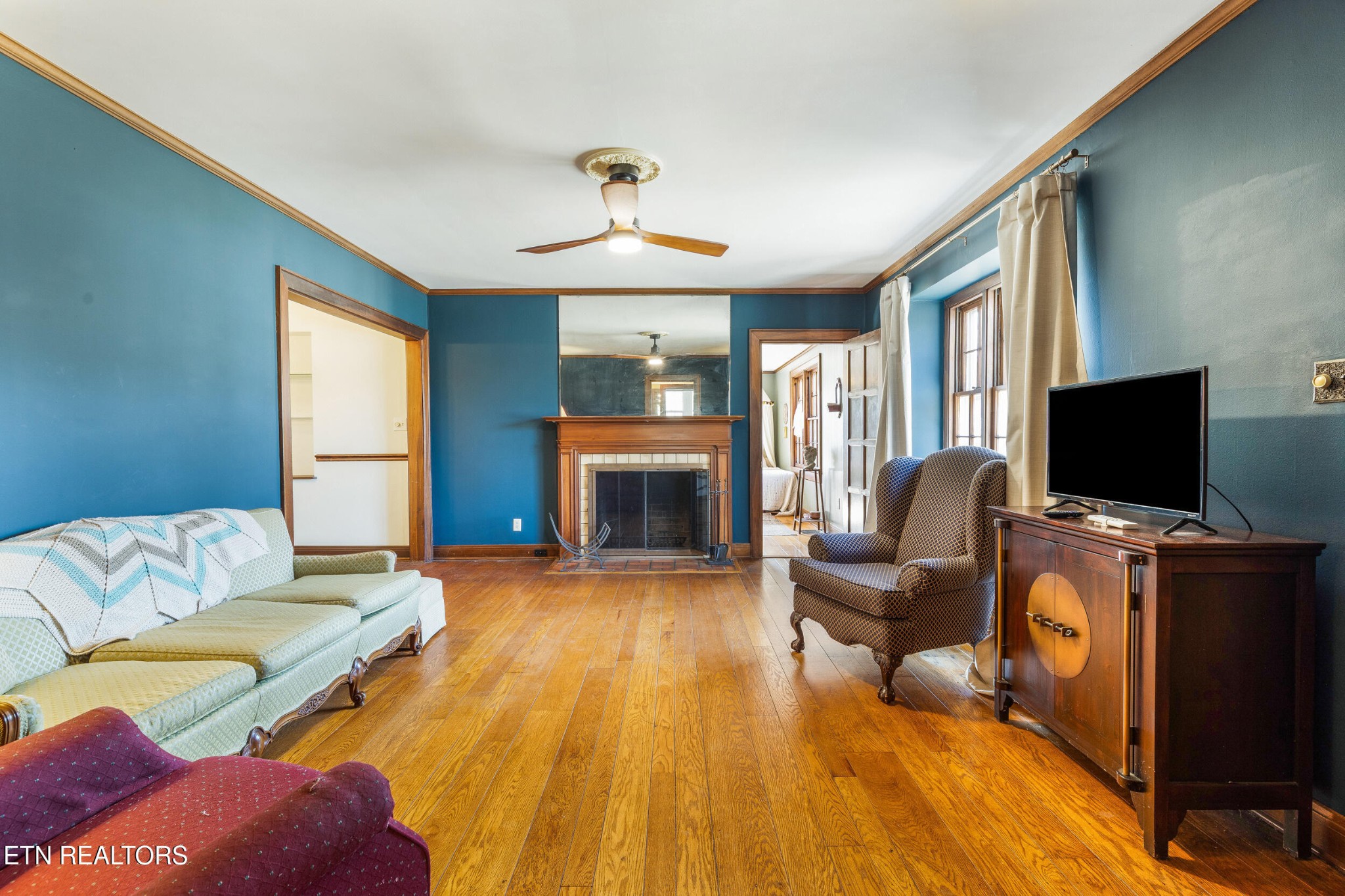 200 East Red Bud Road Knoxville, TN 37920 - Photo 16 of 60 a living room with furniture fireplace and flat screen tv
