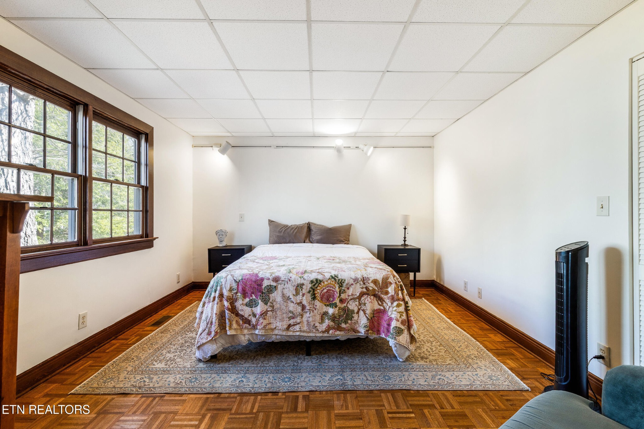 200 East Red Bud Road Knoxville, TN 37920 - Photo 25 of 60 a bed sitting in a bedroom next to a window