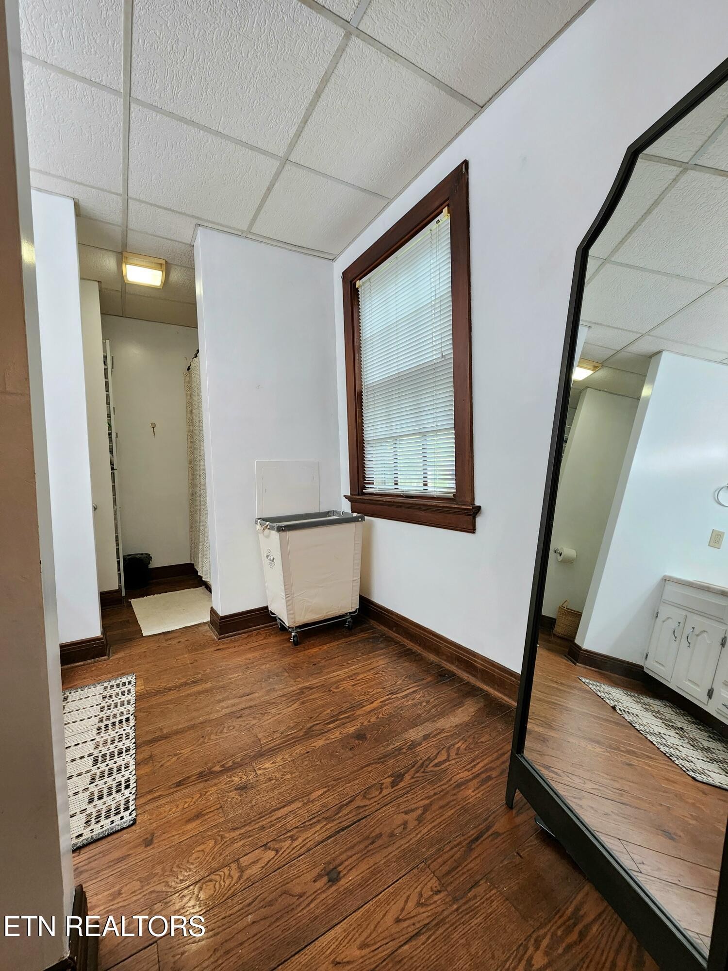 200 East Red Bud Road Knoxville, TN 37920 - Photo 27 of 60 a view of an empty room with wooden floor and a window