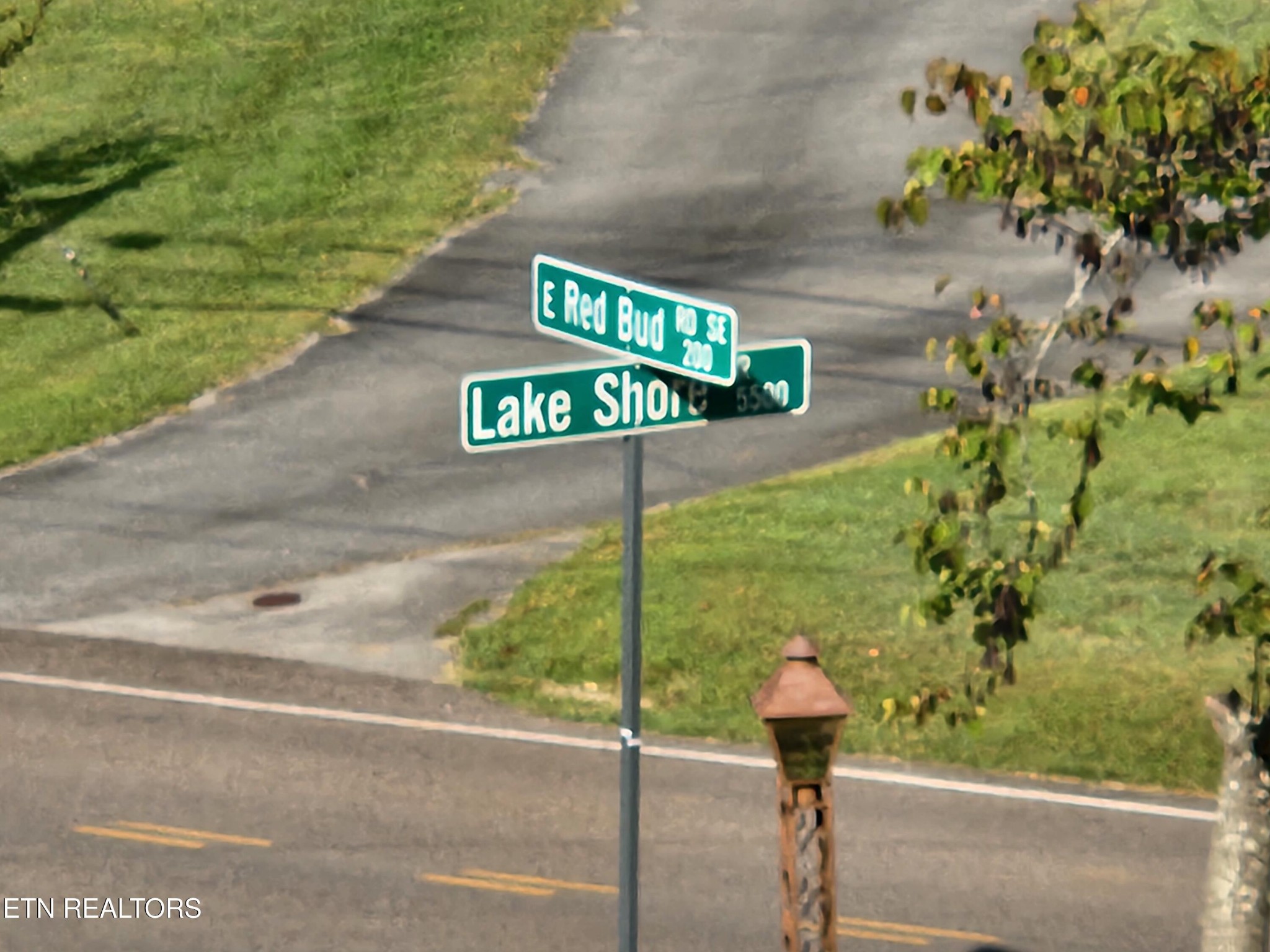 200 East Red Bud Road Knoxville, TN 37920 - Photo 50 of 60 a street sign on a wall next to a road