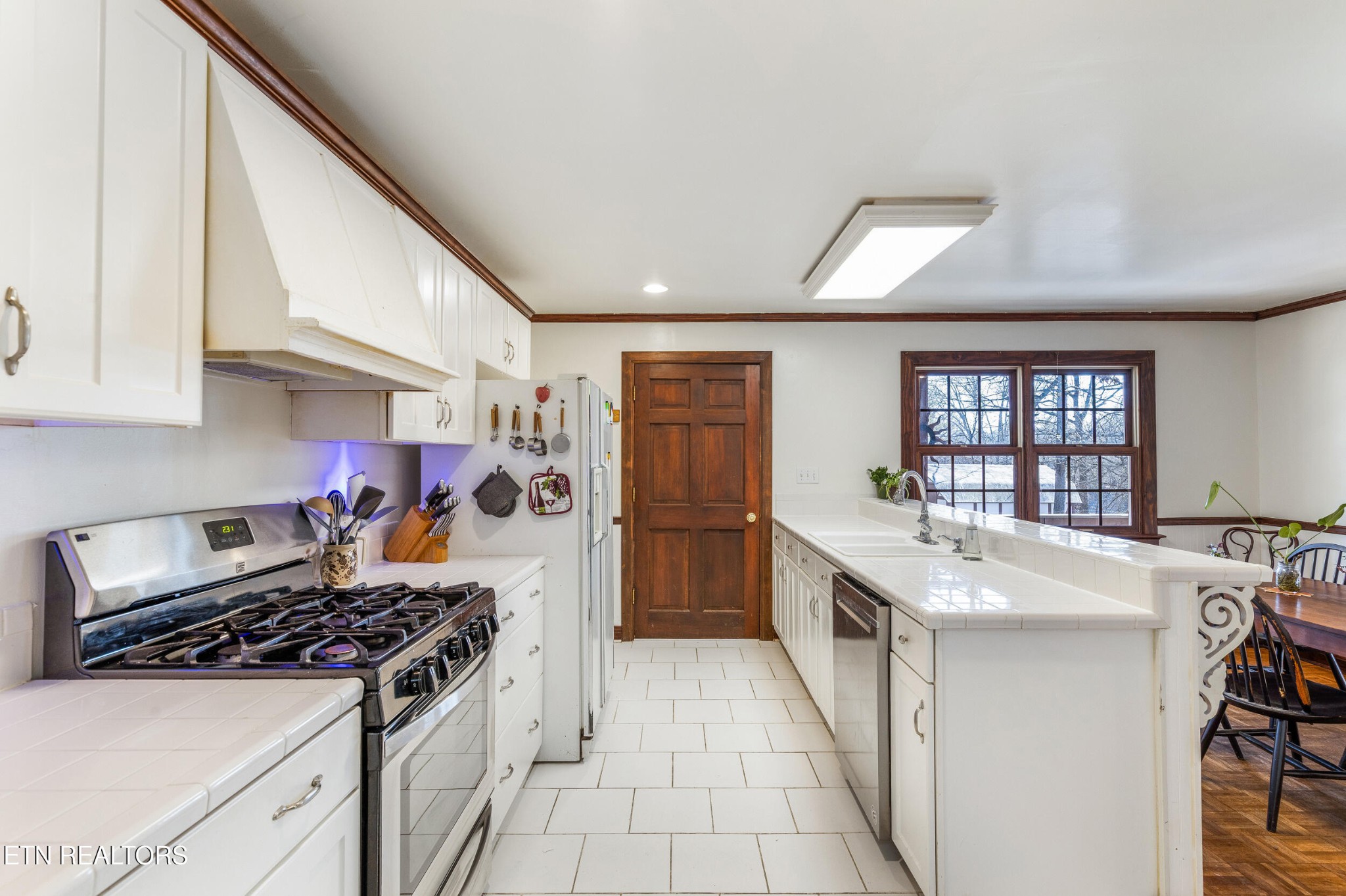 200 East Red Bud Road Knoxville, TN 37920 - Photo 8 of 60 a kitchen with a stove and a refrigerator