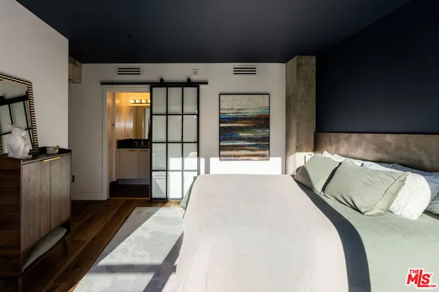 a living room with fireplace furniture and a window