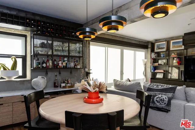 a dining room with furniture and window