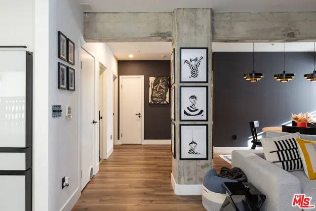 a bathroom with a granite countertop sink mirror vanity and toilet