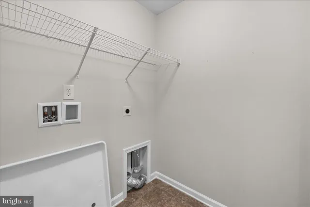 a view of a room that has a fan and a window