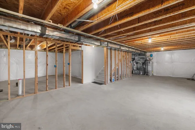 a view of empty room with wooden walls