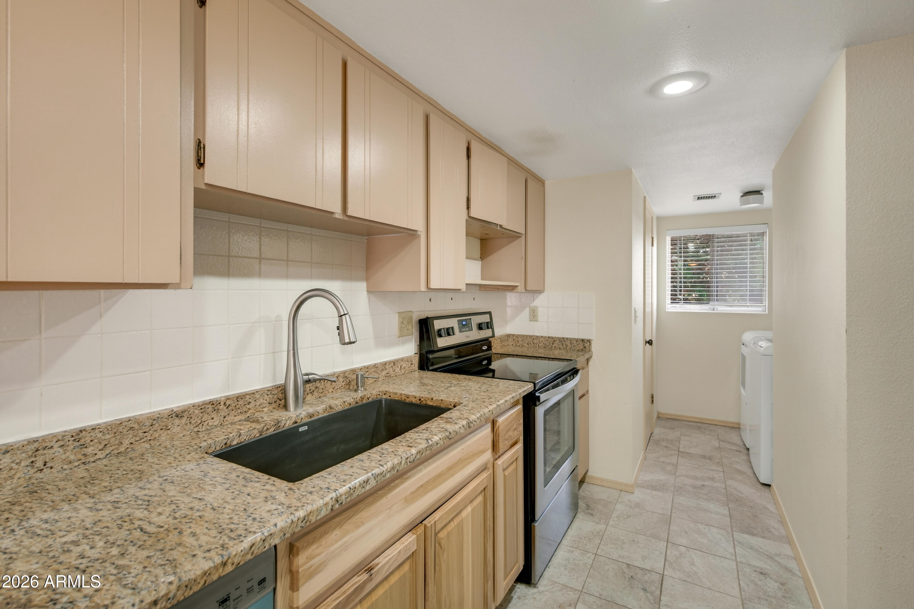 130 Castle Rock Road, Unit 66 Sedona, AZ 86351 - Photo 8 of 37 Kitchen Towards Laundry