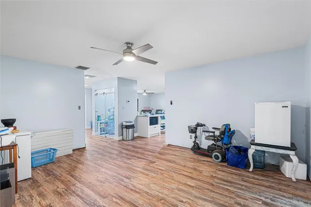 a bed room with furniture and a wooden floor