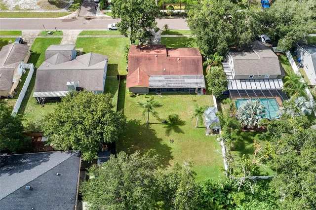 an aerial view of a house with swimming pool