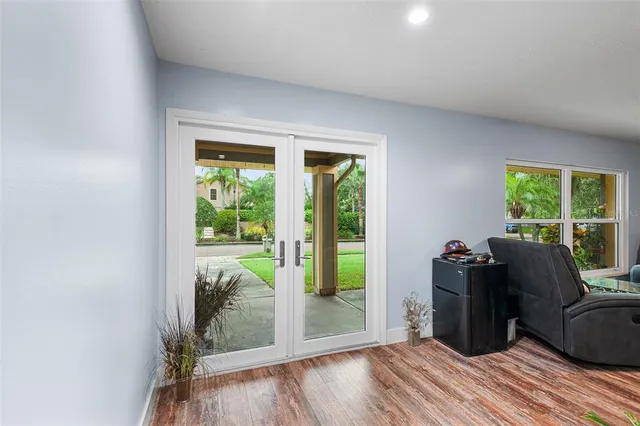 a view of workspace with wooden floor and windows