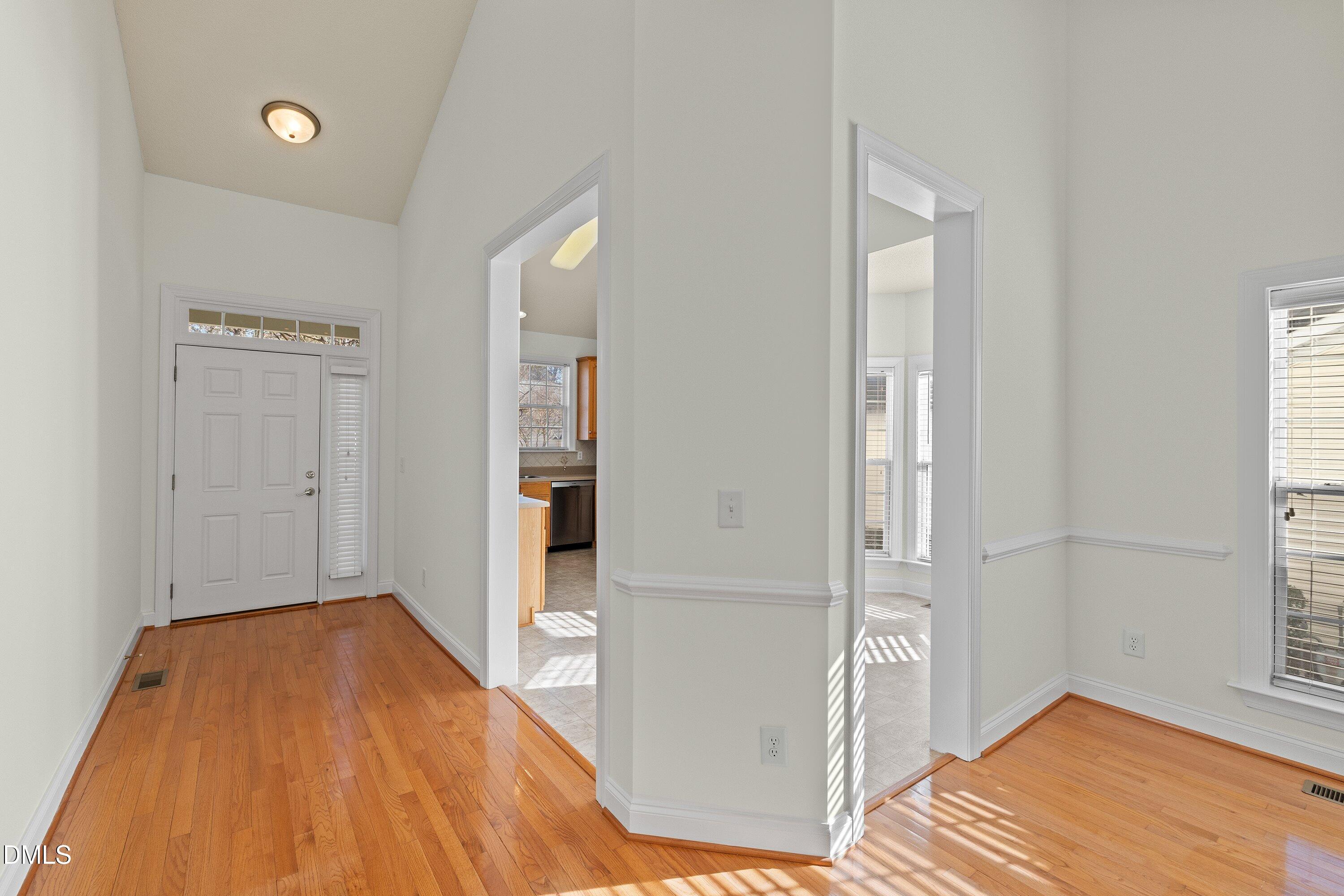 105 Rockport Ridge Way Cary, NC 27519 - Photo 3 of 43 a view of a room with wooden floor and a bathroom