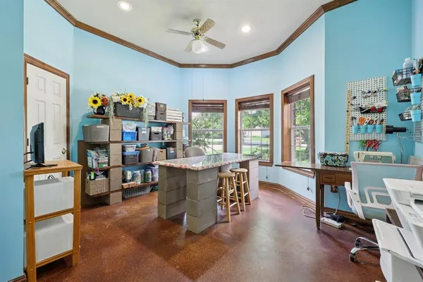a dining room with furniture window and wooden floor