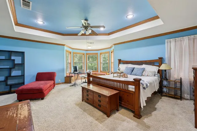 a bedroom with furniture and a window